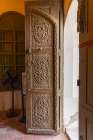 Saudi Arabia, Mecca Province, Jeddah. Ornately carved wooden door in the Al-Balad district. Art Print